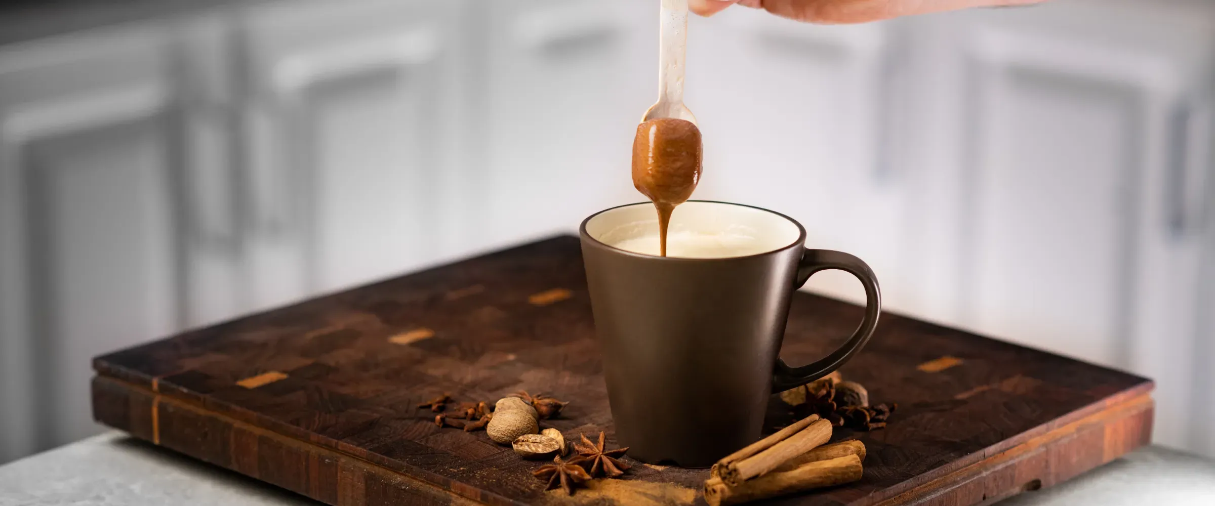 Drinking chocolate dripping into cup