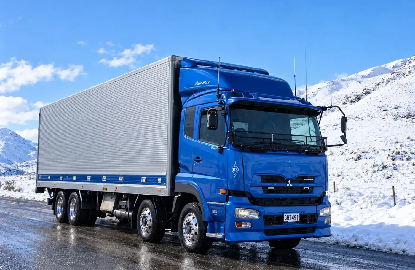 A Platinum Freight truck on a snowbound alpine road